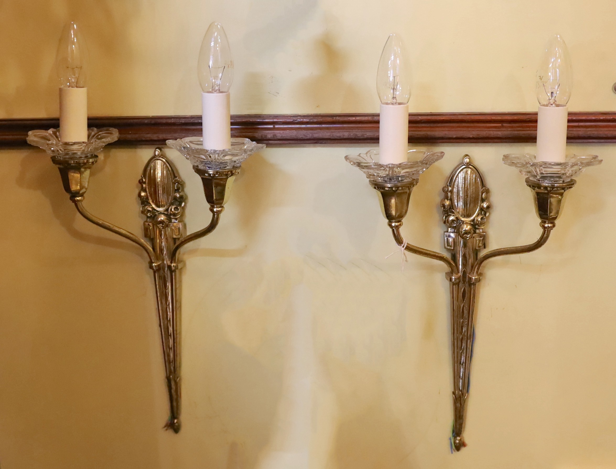 A pair of 1930s French silver brass and glass twin branch wall lights, height 41cm to top of bulb holders, width 26cm